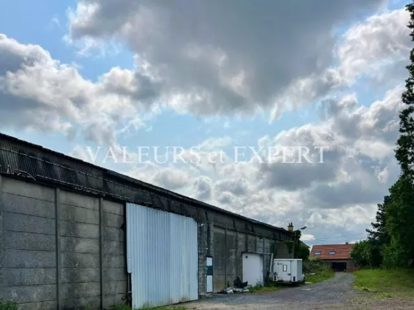1ère de toutes les photos avant Terrain constructible avec entrepôt à Libercourt - Valeurs et Expert