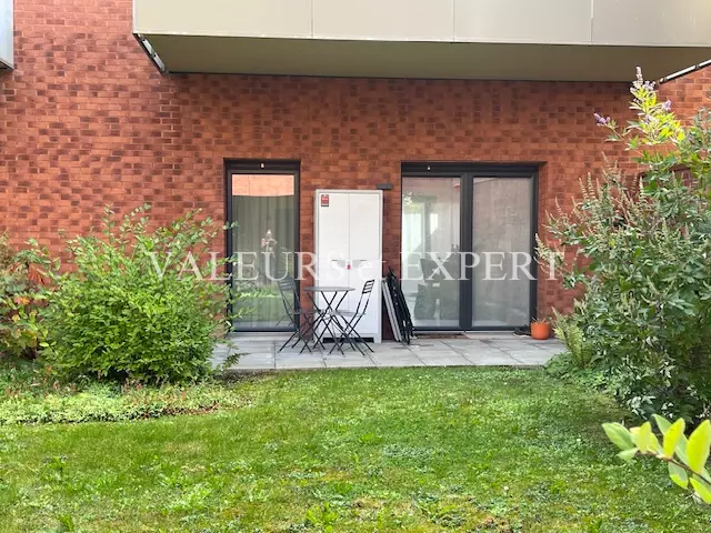 façade brique et jardin appartement Lille